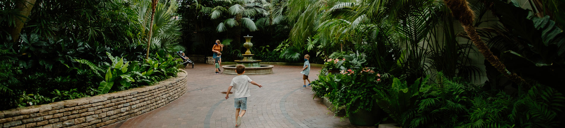 children on a greenpath in the gardens
