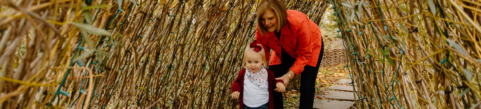 mother and child walking through an arch