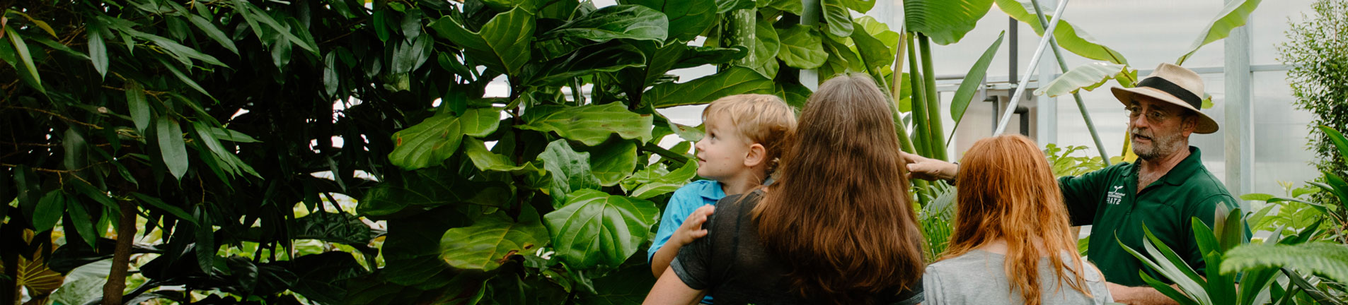 guest and a tour guide looking at greenery