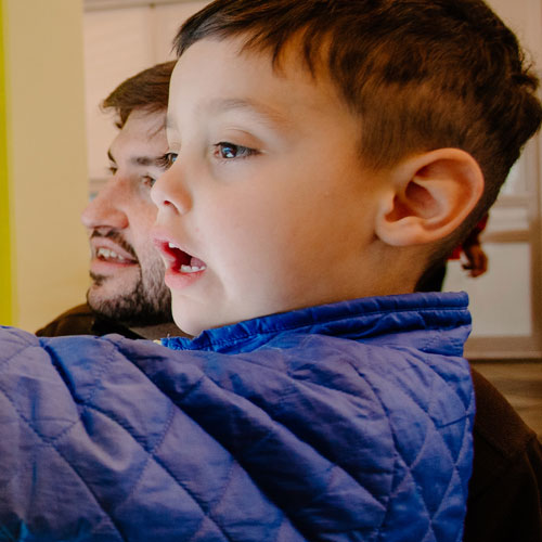 a child pointing at butterfly display
