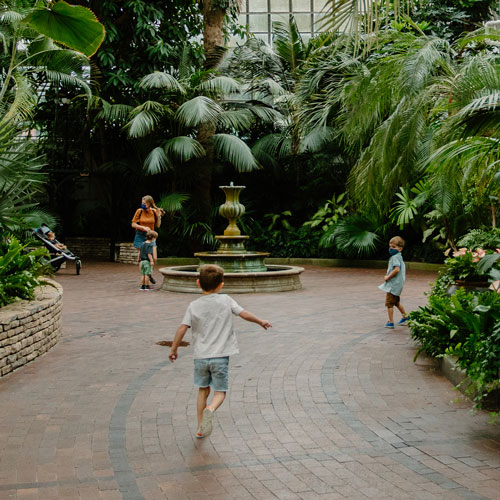 children on a greenpath in the gardens